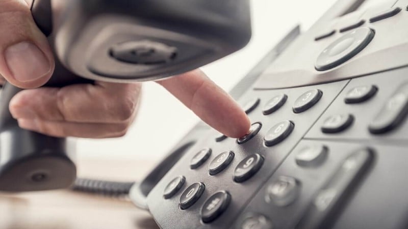 Hand dialing numbers on a landline telephone